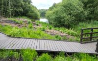 looking towards foremark reservoir across a recycled plastic boardwalk