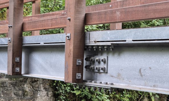steel bridge beams spliced together with bolts
