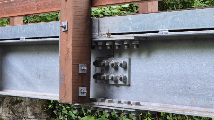 Spliced bridge beams on a Bison pedestrian bridge
