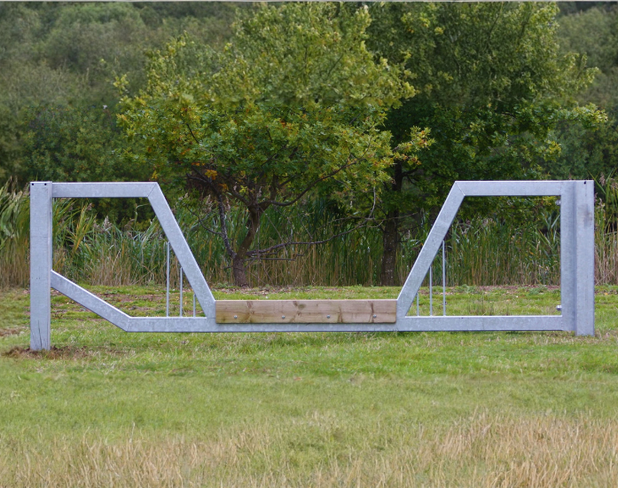Step-over section with timber cladding on horse friendly barrier
