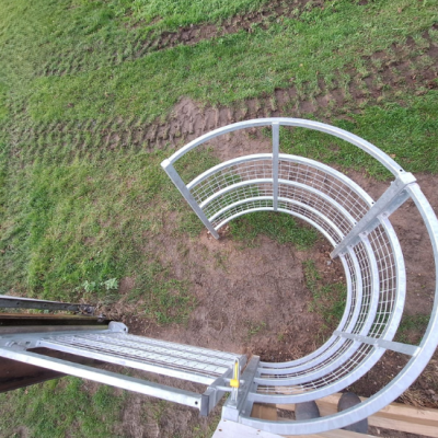 a steel kissing gate that allows people through but not livestock
