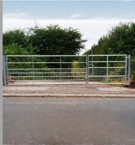 The Ravensden Gate - a self closing galvanised steel gate along with a meshed field Gate