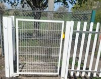 White steel pedestrian gate for use at a rail crossing