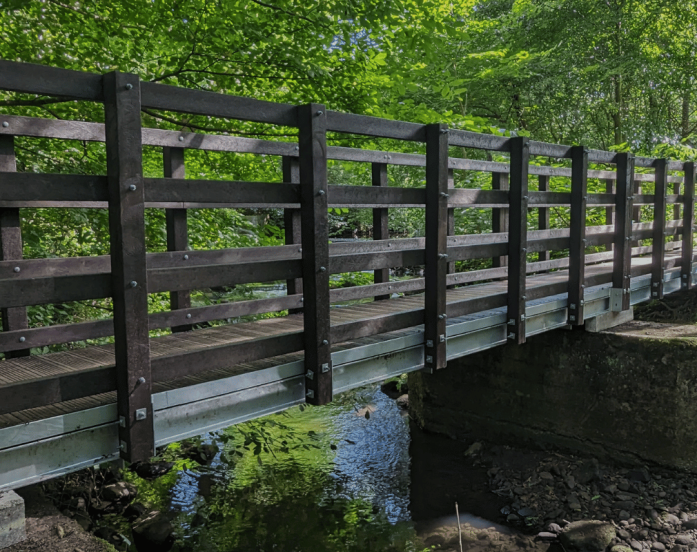 10 metre footbridge with recycled plastic deck boards and parapets