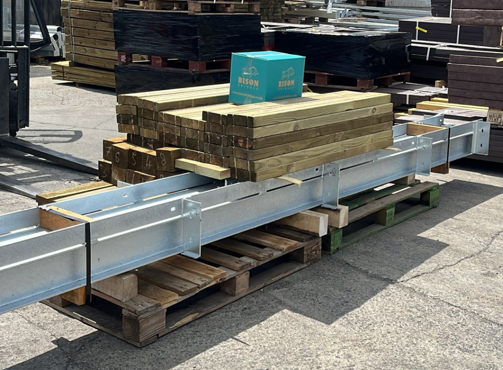 steel beams and decking board components for a pedestrian bridge held in stock by Built by Bison