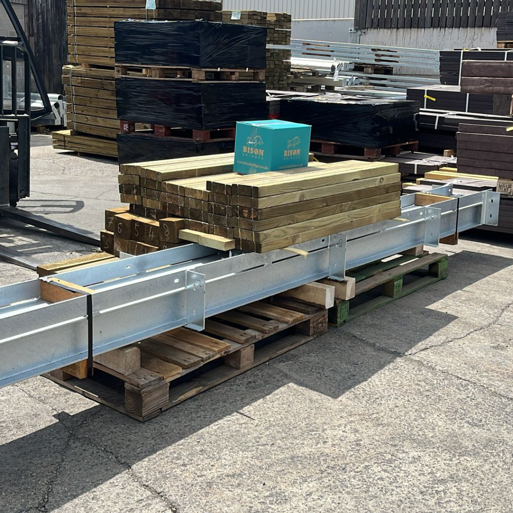 steel beams and decking board components for a pedestrian bridge held in stock by Built by Bison